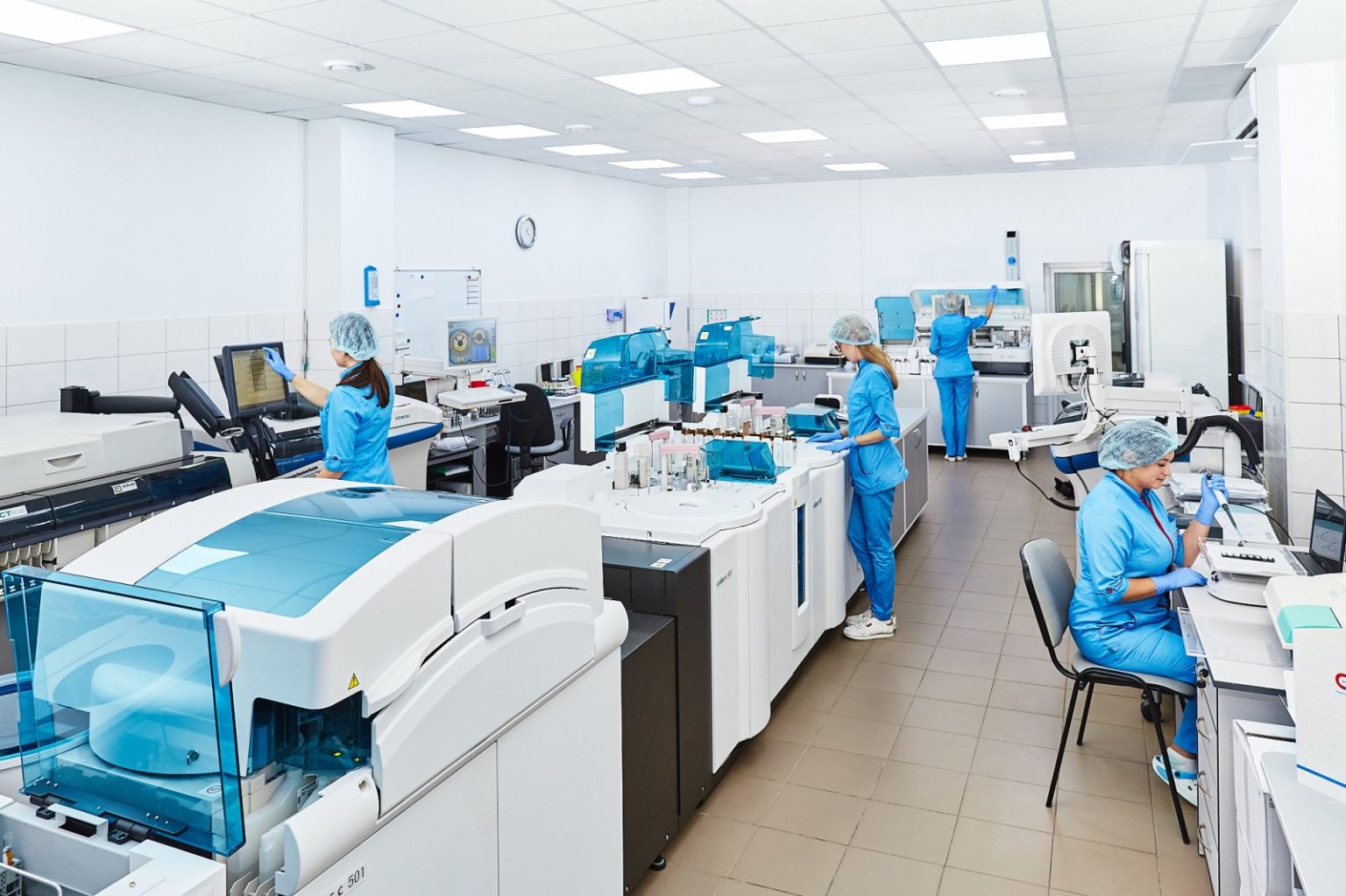 The Gut-Brain Axis Moves From Hype to Evidence Scientists working together at benches in a modern research laboratory